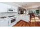 Modern white kitchen with stainless steel appliances and hardwood floors at 2517 Charter Oaks Dr, Mount Pleasant, SC 29466