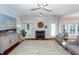 Spacious living room with fireplace, hardwood floors and large windows at 2517 Charter Oaks Dr, Mount Pleasant, SC 29466