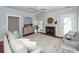 Living room with fireplace, hardwood floors, and ceiling fan at 2517 Charter Oaks Dr, Mount Pleasant, SC 29466