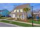 Yellow house with white shutters, front porch, and landscaping at 2725 Battery Pringle Dr, Johns Island, SC 29455