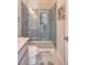 Updated bathroom with a glass shower, gray tile, and a quartz countertop at 2725 Battery Pringle Dr, Johns Island, SC 29455