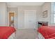 Bedroom with two twin beds, double doors, and window at 2725 Battery Pringle Dr, Johns Island, SC 29455