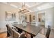 Spacious dining room features a wooden table, bench seating, and a chandelier at 2725 Battery Pringle Dr, Johns Island, SC 29455