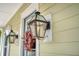 Elegant exterior lantern light fixture next to front door at 2725 Battery Pringle Dr, Johns Island, SC 29455