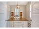 Home office with built-in shelving, wood desk, and window with shutters at 2725 Battery Pringle Dr, Johns Island, SC 29455
