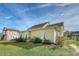Yellow house exterior with white shutters and landscaping at 2725 Battery Pringle Dr, Johns Island, SC 29455