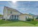 Two-story house with screened porch and landscaped yard at 2725 Battery Pringle Dr, Johns Island, SC 29455