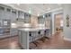 Modern kitchen with gray cabinets, quartz counters, and stainless steel appliances at 2725 Battery Pringle Dr, Johns Island, SC 29455