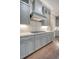 Gray kitchen cabinets, stainless steel appliances and quartz countertops at 2725 Battery Pringle Dr, Johns Island, SC 29455