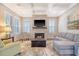 Living room with fireplace, sectional sofa, and coffered ceiling at 2725 Battery Pringle Dr, Johns Island, SC 29455
