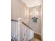 Elegant staircase with white railings and unique wall art at 2725 Battery Pringle Dr, Johns Island, SC 29455