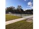 Outdoor community tennis courts with a new looking fence and walkway are available on the property at 2725 Battery Pringle Dr, Johns Island, SC 29455