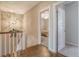 Upstairs hallway with hardwood floors and access to bedrooms at 2725 Battery Pringle Dr, Johns Island, SC 29455