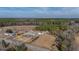 Expansive property featuring a home, outbuildings, and surrounded by lush forest at 2830 Wire Rd, Saint George, SC 29477