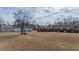 Spacious backyard featuring a well-maintained lawn, detached garage, and outbuilding at 2830 Wire Rd, Saint George, SC 29477