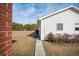 House with white siding with a sidewalk leading to the red brick building at 2830 Wire Rd, Saint George, SC 29477