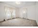 Bedroom with neutral carpet, and windows dressed in sheer, elegant, white curtains at 2830 Wire Rd, Saint George, SC 29477