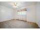Bright bedroom with a ceiling fan, neutral carpet, and natural light from the windows at 2830 Wire Rd, Saint George, SC 29477