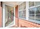 Welcoming entryway with brick accents and glass door providing ample light at 2830 Wire Rd, Saint George, SC 29477