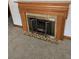 Close-up of the fireplace with a wood mantel and tile hearth at 2830 Wire Rd, Saint George, SC 29477