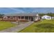 Well-maintained brick house with a spacious yard and a detached garage at 2830 Wire Rd, Saint George, SC 29477
