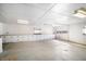 Spacious garage with overhead lighting, storage cabinets, and room for multiple vehicles at 2830 Wire Rd, Saint George, SC 29477