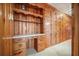 Hallway features wood cabinets, shelving, and a built-in desk, perfect for storage at 2830 Wire Rd, Saint George, SC 29477
