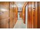 Hallway lined with many wood cabinets and drawers along the walls with doors to other rooms at 2830 Wire Rd, Saint George, SC 29477
