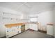 Efficient kitchen space with white cabinets, appliances, and practical shelving for storage at 2830 Wire Rd, Saint George, SC 29477