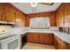 Charming kitchen with wooden cabinets, white countertops, and a window providing natural light at 2830 Wire Rd, Saint George, SC 29477