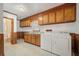 Functional laundry room with ample cabinet space, washer, dryer, and wood paneling at 2830 Wire Rd, Saint George, SC 29477
