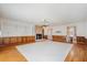 Bright living room boasts hardwood floors, custom drapes, and a charming brick fireplace at 2830 Wire Rd, Saint George, SC 29477
