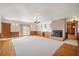 Spacious living room features a brick fireplace, wood floors, and built-in shelving at 2830 Wire Rd, Saint George, SC 29477