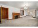 Inviting living room with a fireplace, built-in shelves and decorative chandelier at 2830 Wire Rd, Saint George, SC 29477