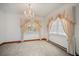 Living room with ample natural light, decorative chandelier and elegant window treatments at 2830 Wire Rd, Saint George, SC 29477