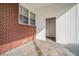 An outdoor patio with white vinyl siding and a brick wall at 2830 Wire Rd, Saint George, SC 29477