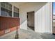 A patio with brick and white vinyl siding and a door at 2830 Wire Rd, Saint George, SC 29477