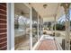 Outdoor porch with brick flooring and wrought iron railing, perfect for relaxing at 2830 Wire Rd, Saint George, SC 29477