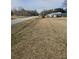 Expansive property lot on a quiet street, showcasing potential for landscaping and development at 2830 Wire Rd, Saint George, SC 29477