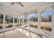 Bright sunroom featuring floor-to-ceiling windows offering serene outdoor views with wood floors at 2830 Wire Rd, Saint George, SC 29477