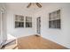 Cozy sunroom with white brick and multiple windows for lots of light on its wood floors at 2830 Wire Rd, Saint George, SC 29477