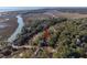 Aerial view of wooded property near marsh and waterway at 2947 Deer Point Dr, Seabrook Island, SC 29455