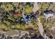 Beautiful aerial view of home site surrounded by mature trees and marshland at 2947 Deer Point Dr, Seabrook Island, SC 29455