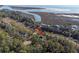 Beautiful home nestled among mature trees with water views in the distance at 2947 Deer Point Dr, Seabrook Island, SC 29455