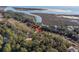 Beautiful home site nestled among mature trees with water views in the distance at 2947 Deer Point Dr, Seabrook Island, SC 29455