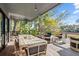 Outdoor deck features dining and seating areas, ideal for enjoying the surrounding natural views at 2947 Deer Point Dr, Seabrook Island, SC 29455