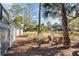 Serene backyard featuring chairs surrounded by lush greenery and scenic views, perfect for relaxation at 2947 Deer Point Dr, Seabrook Island, SC 29455