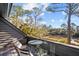 Relaxing outdoor balcony featuring a table and chairs with gorgeous views of the surrounding landscape and waterway at 2947 Deer Point Dr, Seabrook Island, SC 29455