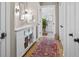 Bathroom featuring dual vanities with marble countertops, modern lighting, and wood-style floor at 2947 Deer Point Dr, Seabrook Island, SC 29455