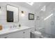 Bright bathroom with glass shower, sleek white vanity and stylish fixtures at 2947 Deer Point Dr, Seabrook Island, SC 29455